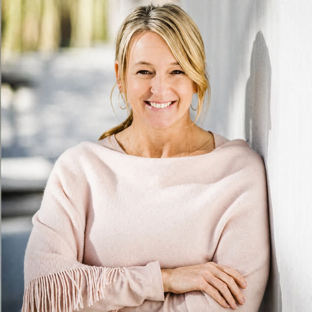 Jill Canning smiling with her hands folded.
