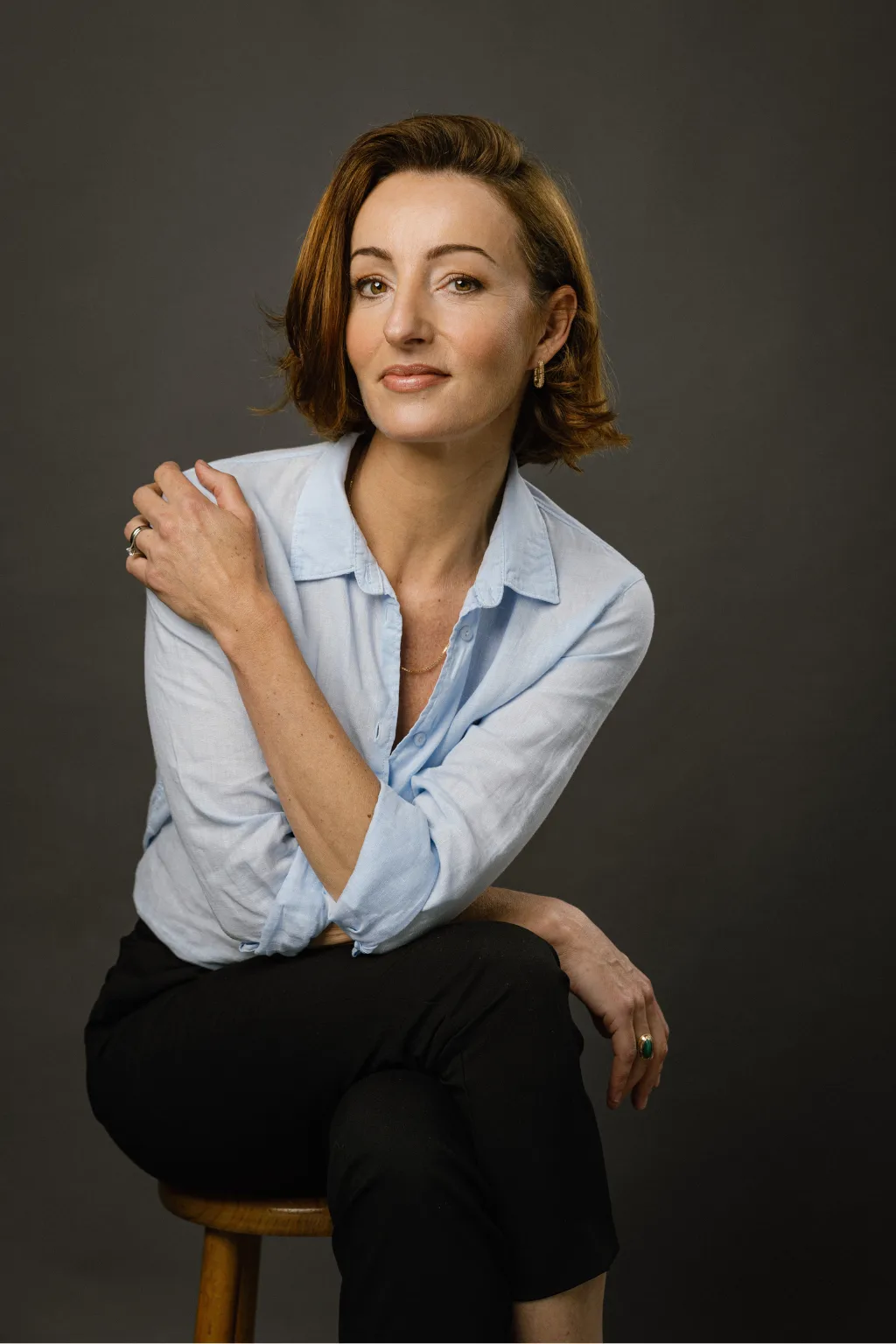Natalie Muschamp headshot, wearing a blue shirt.